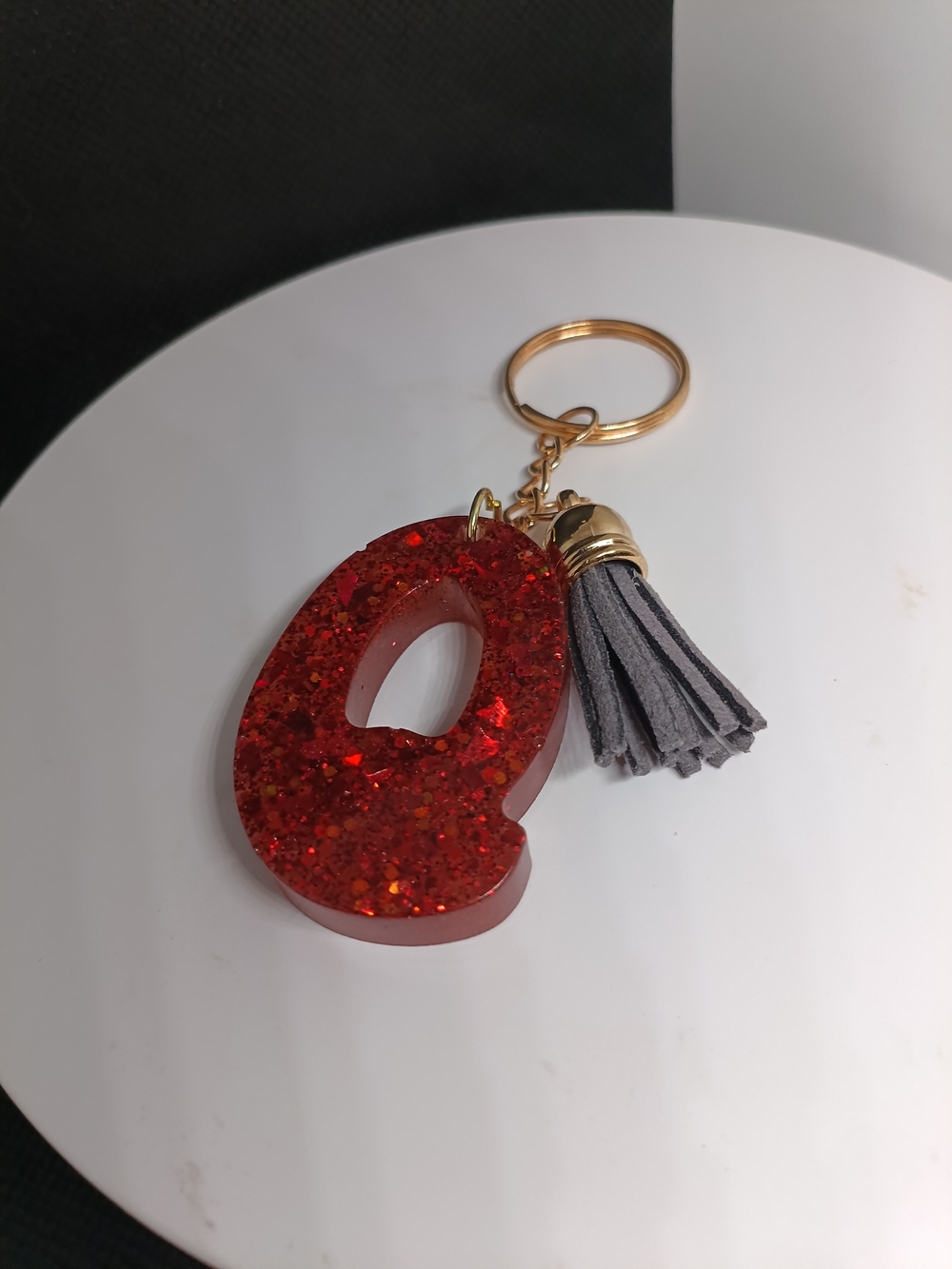 Red Glitter Letter Q Keychain with Gray Tassel